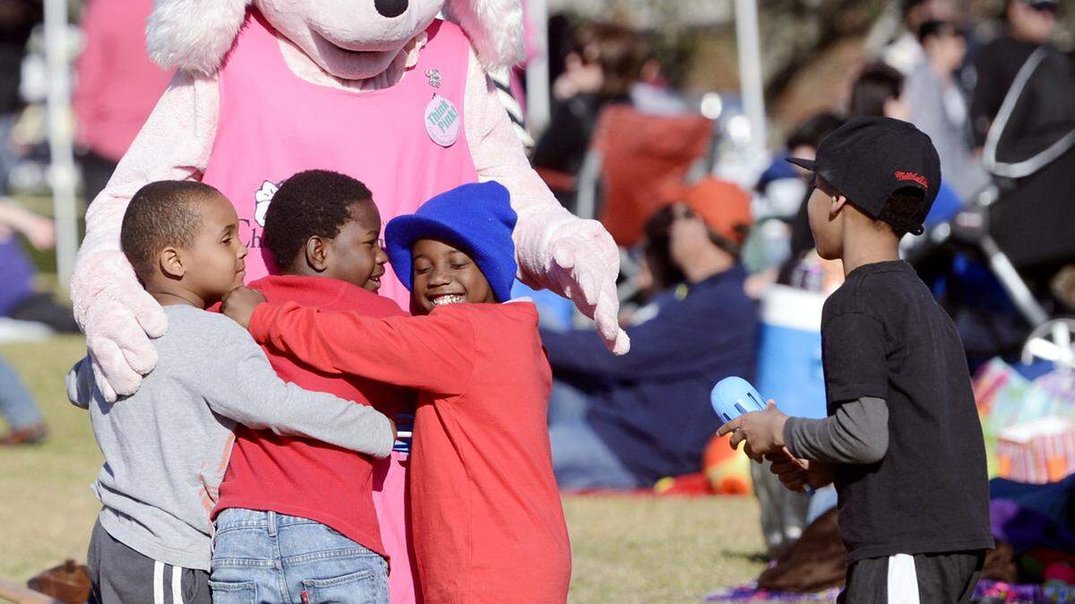 JASON VORHEES/THE TELEGRAPHCherry Blossom Festival mascot Petals gives out hugs during a previous year's Party on the Green event at Wesleyan College.
