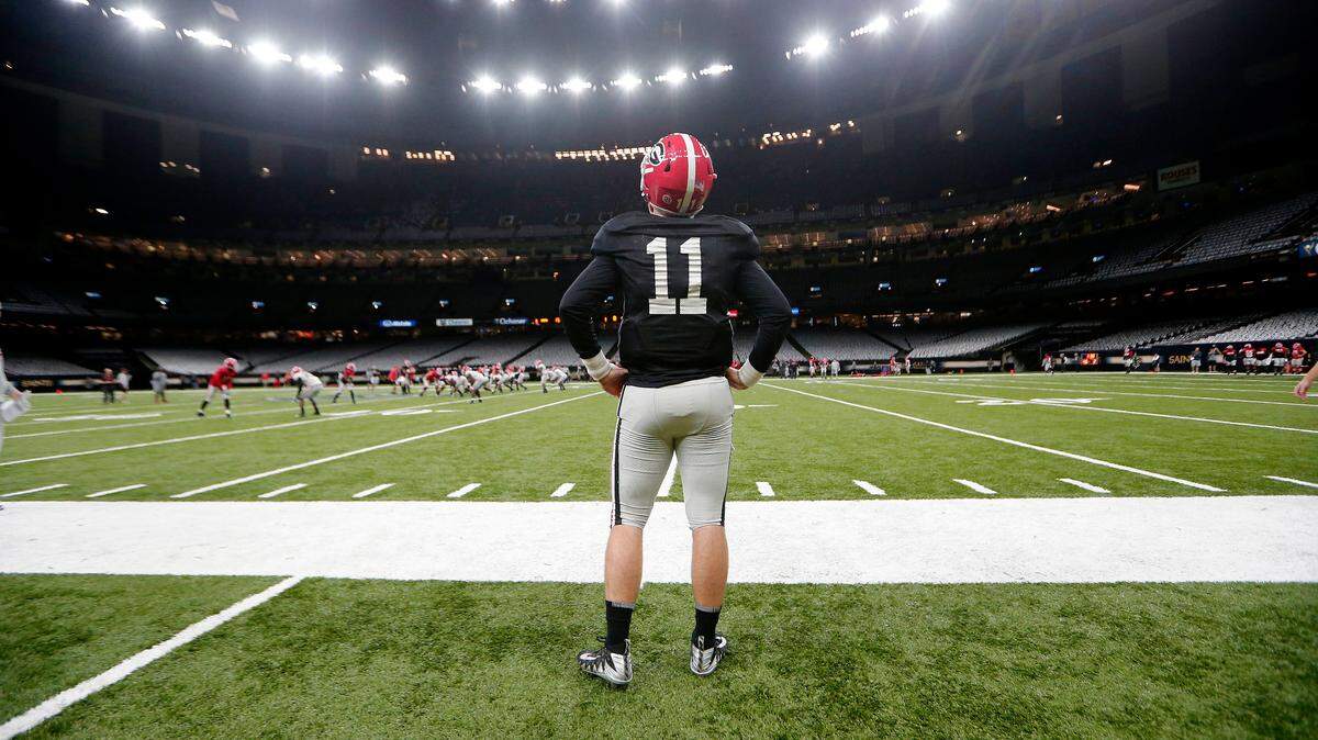 Georgia quarterback Jake Fromm (11) watches drills during practice at the Superdome in New Orleans, Friday, Dec. 28, 2018. Georgia will face Texas in the Sugar Bowl NCAA college football game on Jan. 1, 2019. (AP Photo/Gerald Herbert)