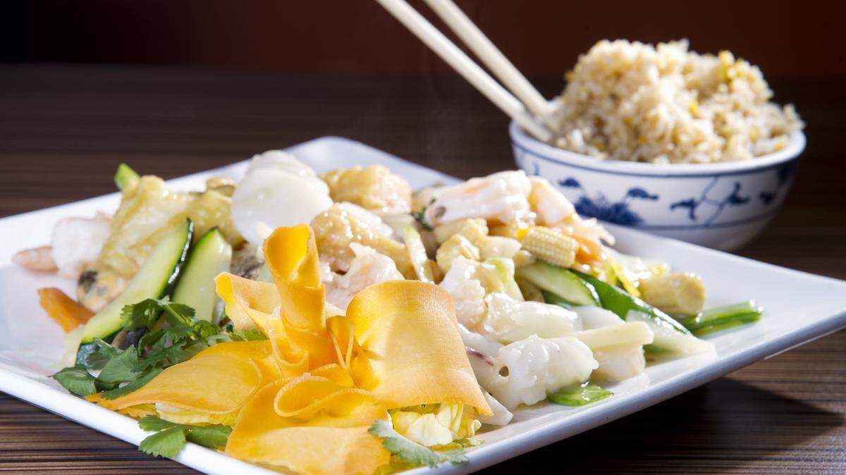 JASON VORHEES/THE TELEGRAPHThe Asian House Seafood Supreme features shrimp, scallops, fish and crab sticks with sauted fresh vegetables and a white wine sauce.