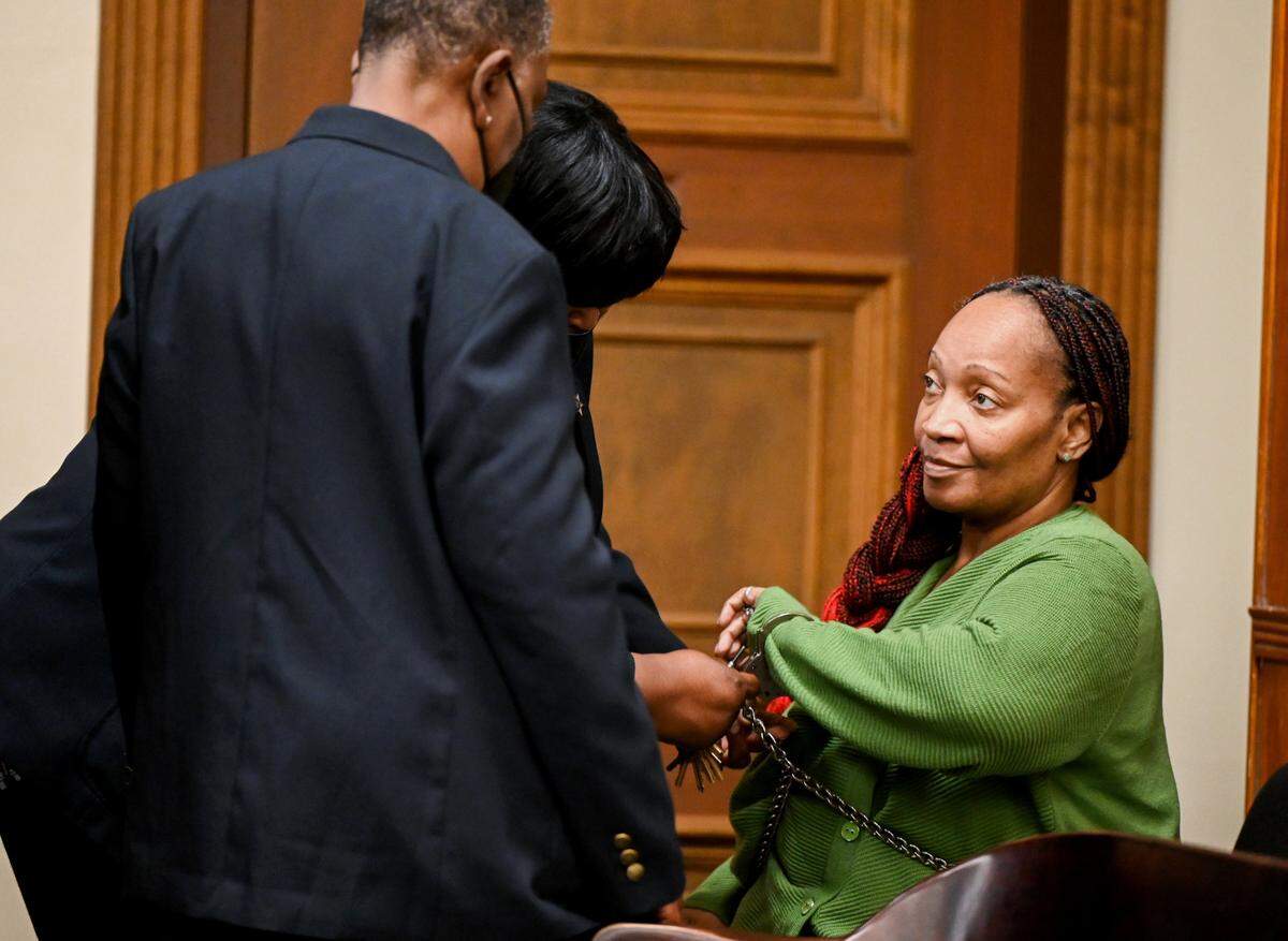 Donna Elyse Jackson has shackles removed in a Bibb County Superior Court Monday prior to jury selection for her murder trial. Jackson is accused of shooting her boyfriend to death during a confrontation in their home seven years ago.