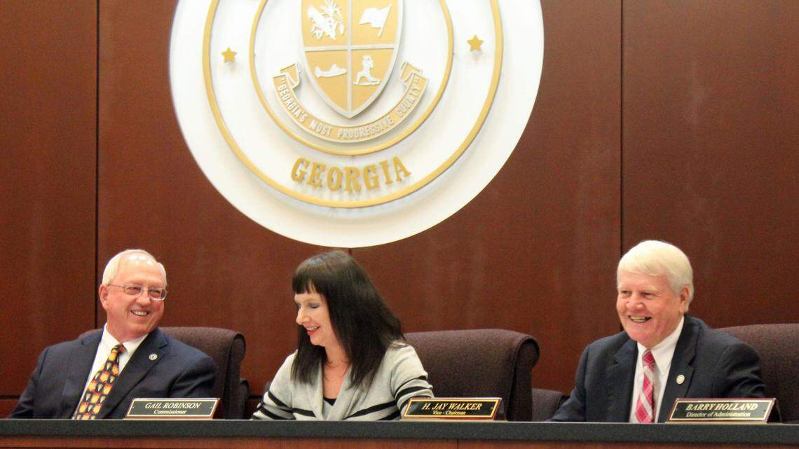 Houston County Commission Chairman Tommy Stalnaker, left, and Commission Jay Walker share a laugh with Commissioner Gail Robinson at a meeting. Stalnaker and Walker are up for re-election this year.