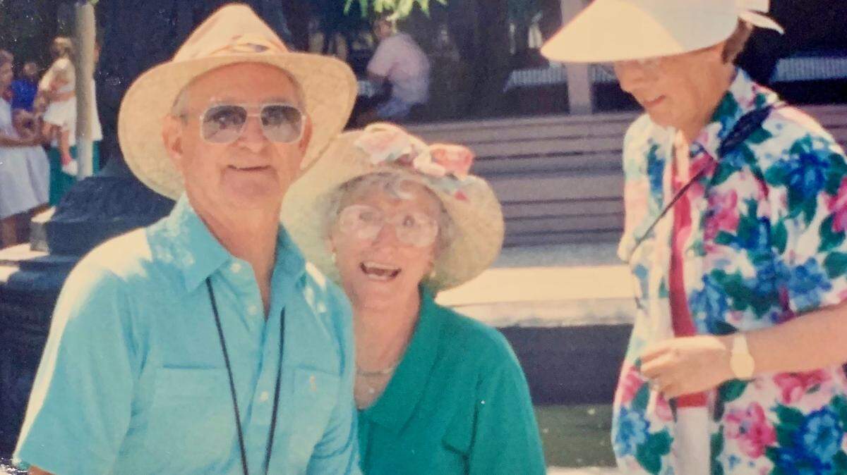 Bill Reeves sits in wife Mary’s lap on June 22, 1995 in Charleston, South Carolina. Diane, Bill’s sister-in-law, right, looks on.