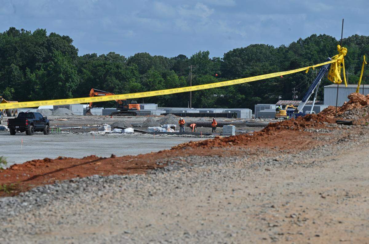 Construction crews work on the site of the new Unified Legacy manufacturing facility off Barnes Ferry Road on Wednesday, May 27, 2026, in Macon, Ga. Georgia-based manufacturing company Unified Legacy will invest $125 million in its new Macon facility.