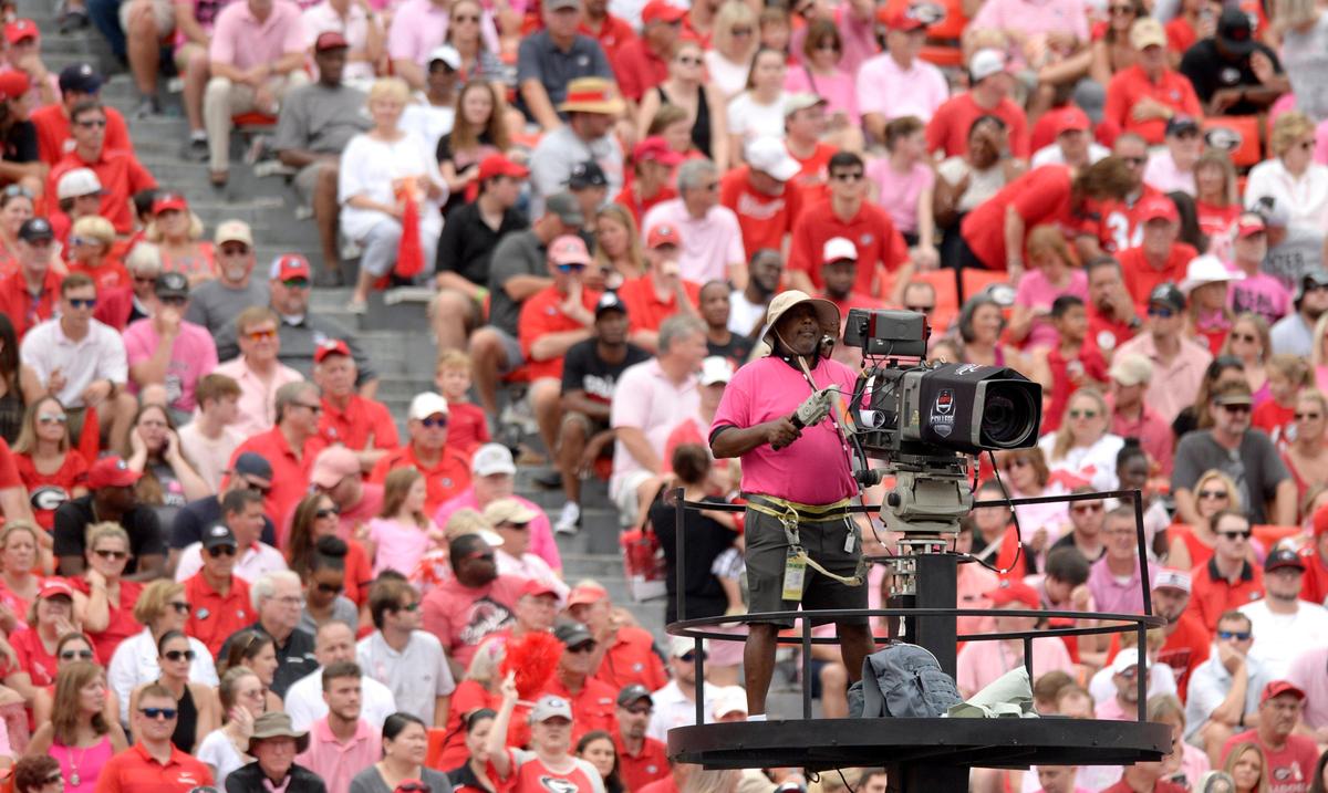 Even the camera crew covering the game for ESPN wore pink to show support for Arkansas State head coach Blake Anderson whose wife Wendy died recently of breast cancer. Fans orchestrated a Pink Out for the game.
