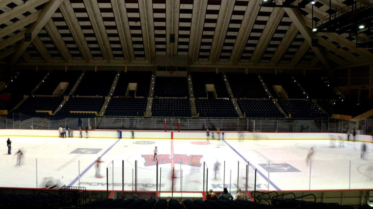 Skaters cover the rink during a public ice skating session at the Macon Coliseum.