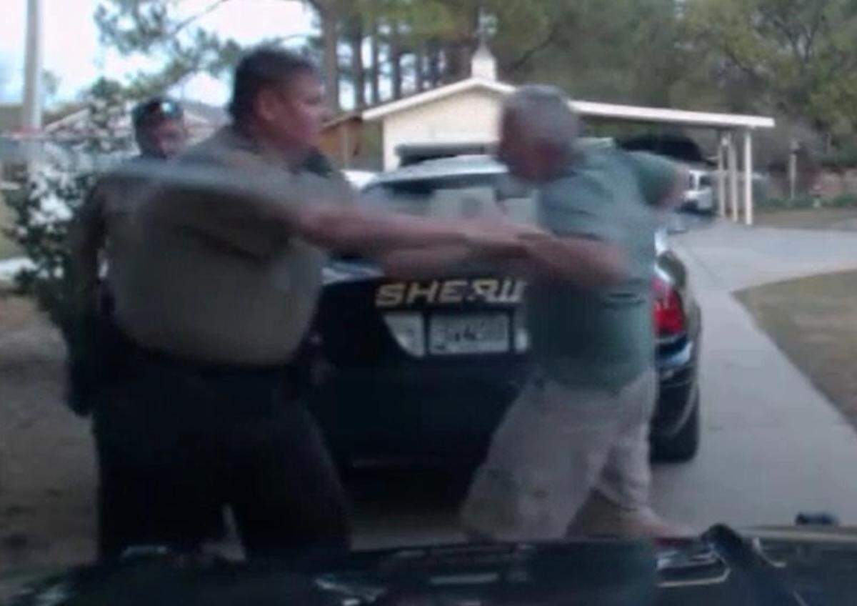 A screen shot from dashcam video of the second before Ralph Elrod shot and mortally wounded Peach County sheriff’s deputies Patrick Sondron and Daryl Smallwood.
