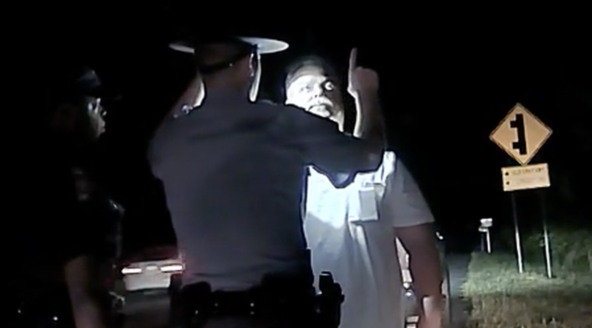 Georgia State Patrol Trooper First Class 2 Michael Brock gives a sobriety evaluation to Bibb County sheriff’s Sgt. Charles Anthony Fordham during a traffic stop for speeding on Gray Highway on April 28, 2018.