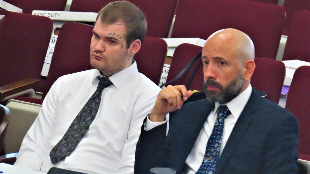 Ricky Dubose, left, in court Wednesday in Putnam County for the first day of testimony in his murder trial in the deaths of two Georgia correctional officers who were killed when Dubose and another inmate allegedly staged a deadly escape from a prison bus in June 2017.