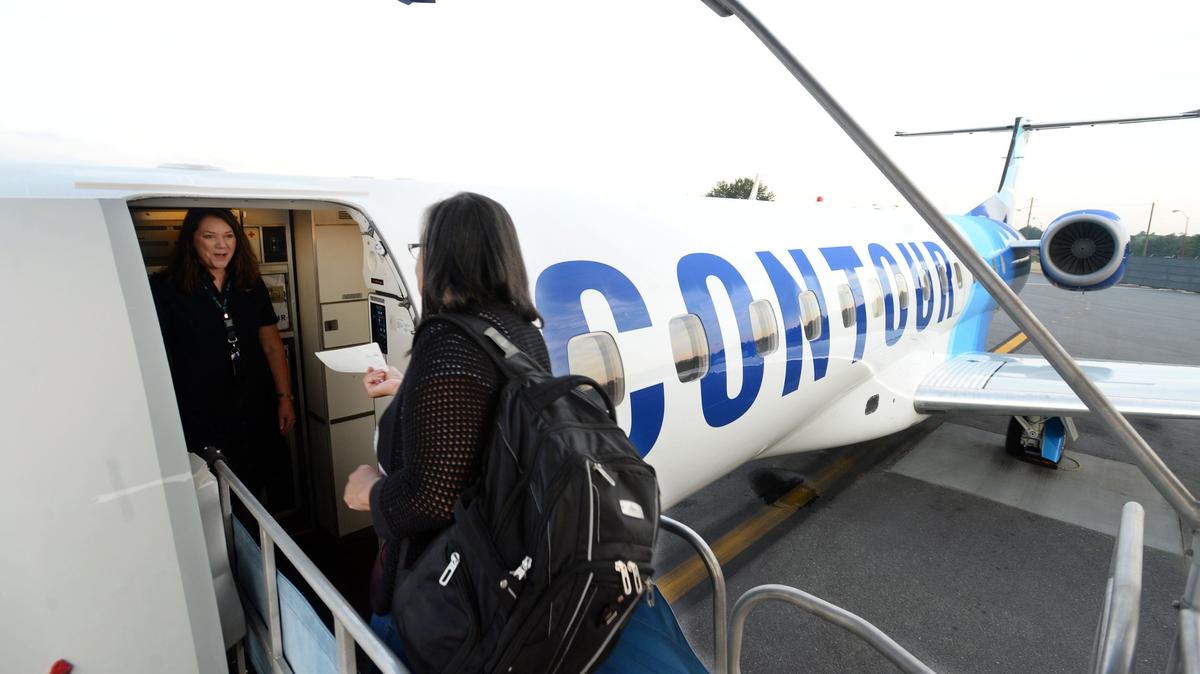 Contour passengers board a nearly full jet headed to Baltimore from the Middle Georgia Regional Airport July 27, 2018.