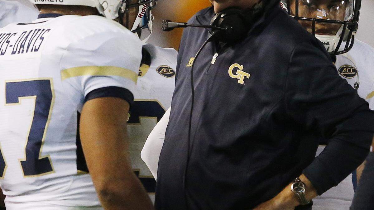 Georgia Tech head coach Paul Johnson speaks in huddle against Florida State during the first half of an NCAA college football game, Saturday, Oct. 24, 2015, in Atlanta. (AP Photo/Mike Stewart)