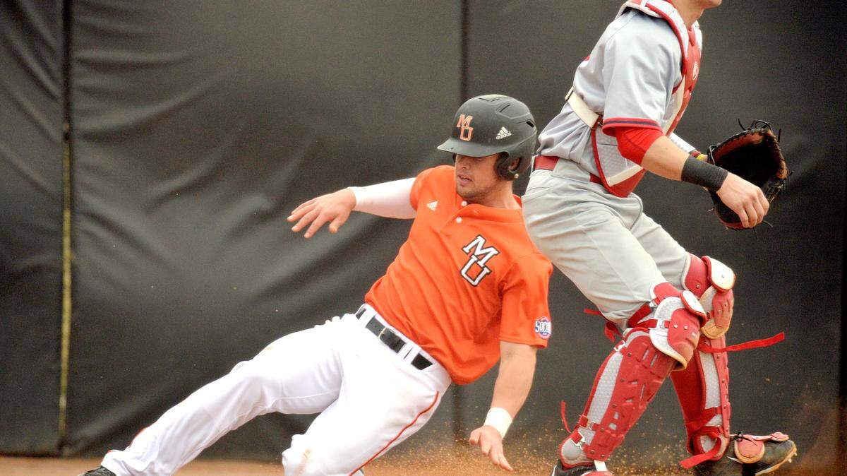 Mercer's Ryan Hagan, left, crosses the plate on a RBI single by teammate Kyle Lewis during their game against Radford on Sunday.