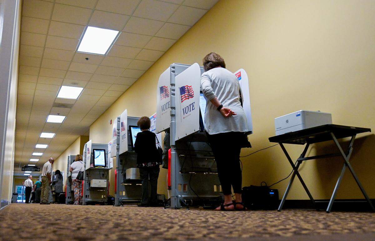 Voters cast their ballots Tuesday morning at Turning Point at Mabel White Baptist Church on Bass Road.