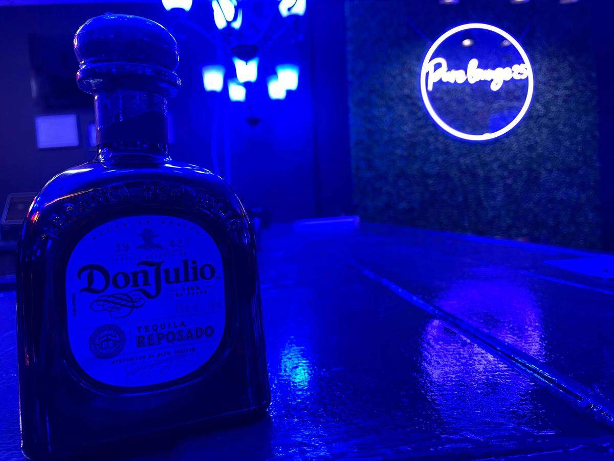 A bottle of Don Julio tequila rests on the bar at Pure Lounge 25 at 115 Margie Drive in Warner Robins.
