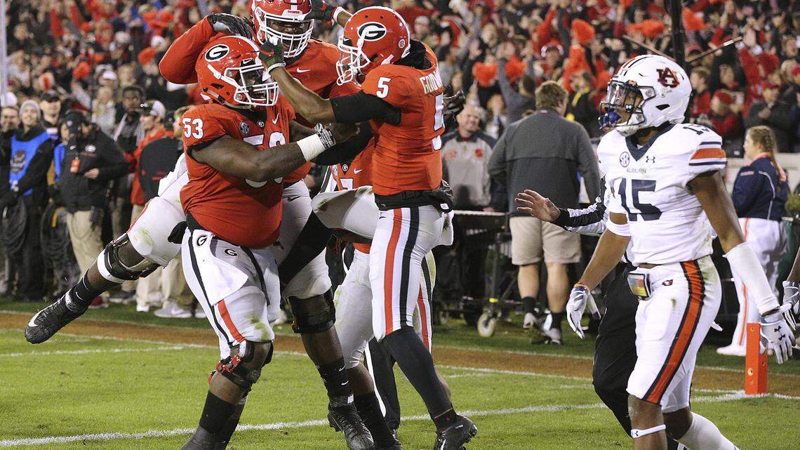 Georgia wide receiver Terry Godwin celebrates his touchdown catch against Auburn just before halftime during their game Saturday in Athens.