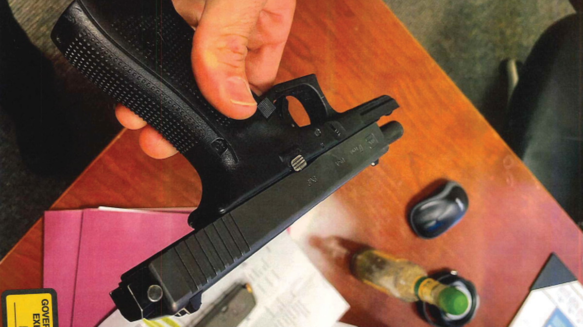 The gun that Monroe police officers found on Terrell Searcy when he was caught possessing a gun at Piedmont Walton Hospital, federal prosecutors said. He pleaded guilty to one count of possessing a machine gun, since the gun had a full-auto sear pin attached to the slide.