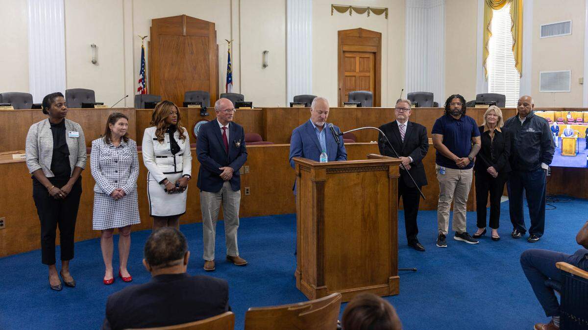 The Macon Justice and Wellness Task Force, which included local law enforcement and crime prevention professionals, joined Macon-Bibb County Mayor Lester Miller (at podium) to announce new jail reform initiatives on June 10, 2025, at the Commission Chamber of City Hall, 700 Poplar St.