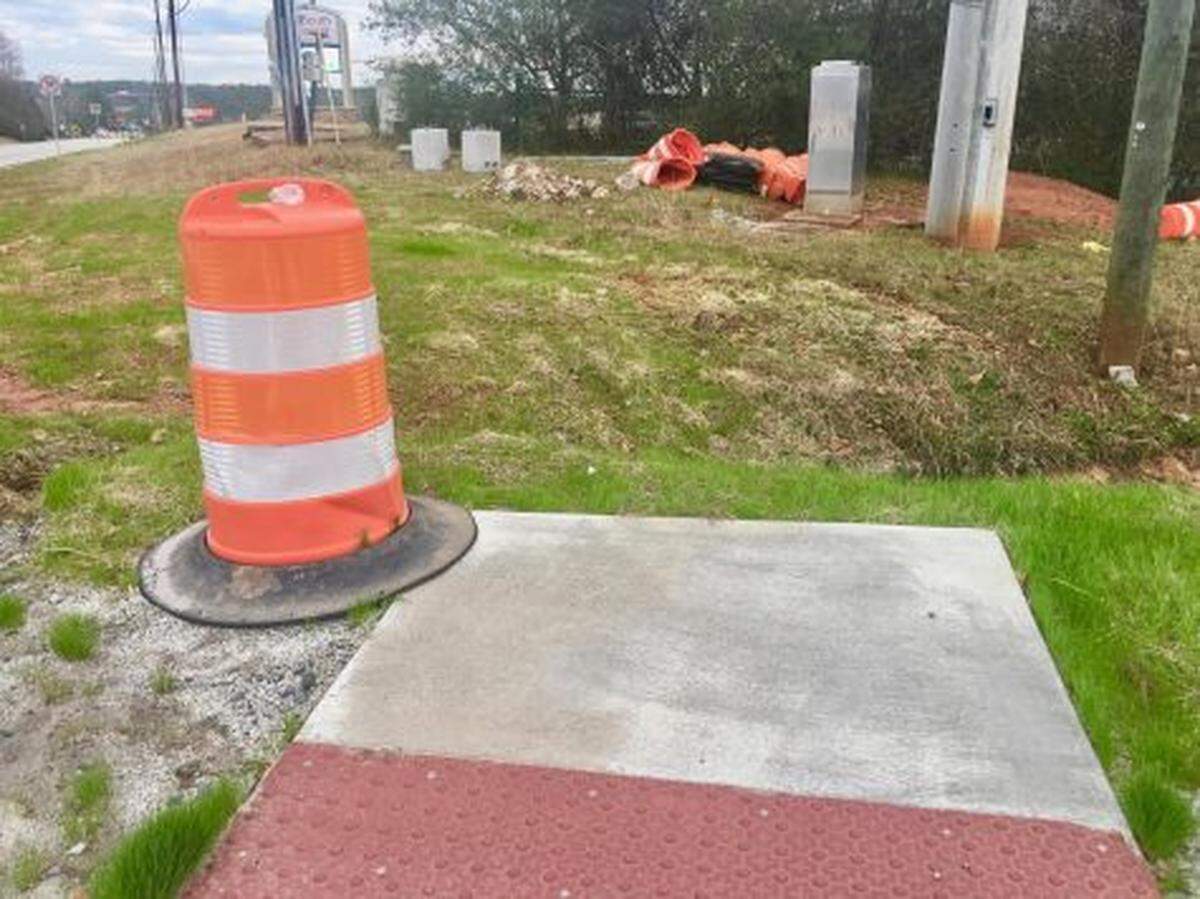 One of the new Bass Road pedestrian crossings at Interstate 75 leads to a drainage ditch.