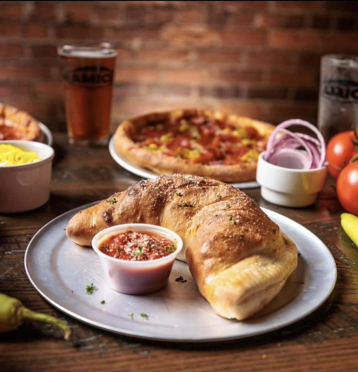 Amici Italian Cafe & Brewery opens soon in Perry. The new restaurant and brewery offers calzones along with pizza, wings, pasta dishes, sandwiches and appetizers.