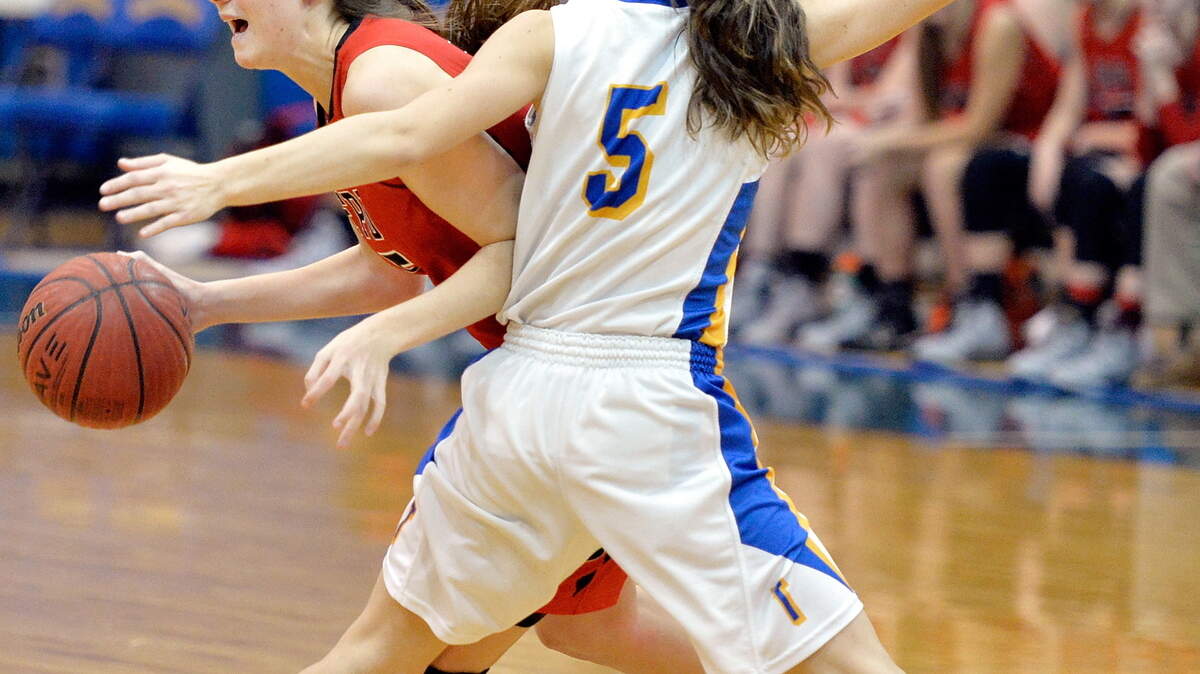FPD's Kate Patterson (5) is pressured by Tattnall's Jordan Allen (5) during their game Friday night.