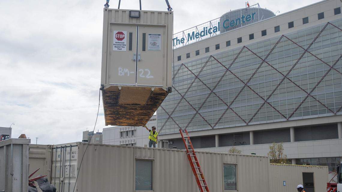 Shipping containers at Macon’s medical center depart for Atlanta housing project