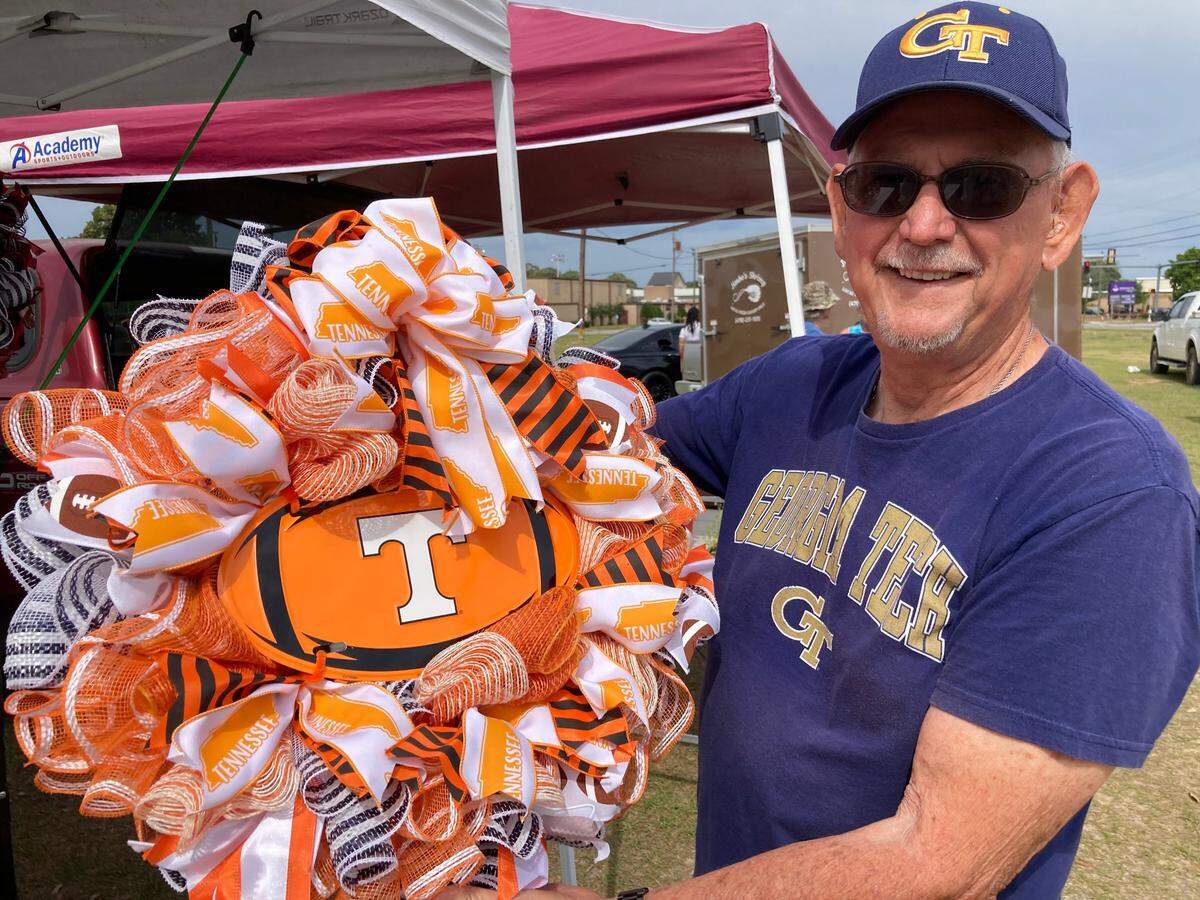 At Helga’s Seasonal Wreaths & Gifts at the International City Farmers Market in Warner Robins, William Willis sells wreaths handcrafted by his wife, Helga.