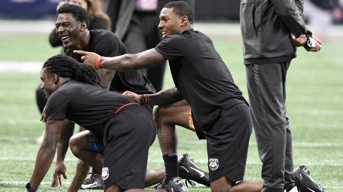 JASON VORHEES/THE TELEGRAPH Atlanta, GA, 11/30/2018:
Georgia receiver Mecole Hardman, right, laughs with his teammates during the Bulldogs walkthrough Friday afternoon at Mercedes-Benz Stadium.