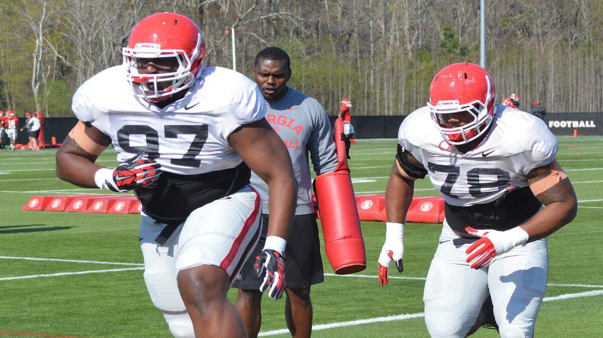Georgia defensive linemen John Atkins (97) and Trenton Thompson (78) during the Bulldogs' spring football practice on Tuesday, March 22, 2016, in Athens, Ga. (Photo by Steven Colquitt)