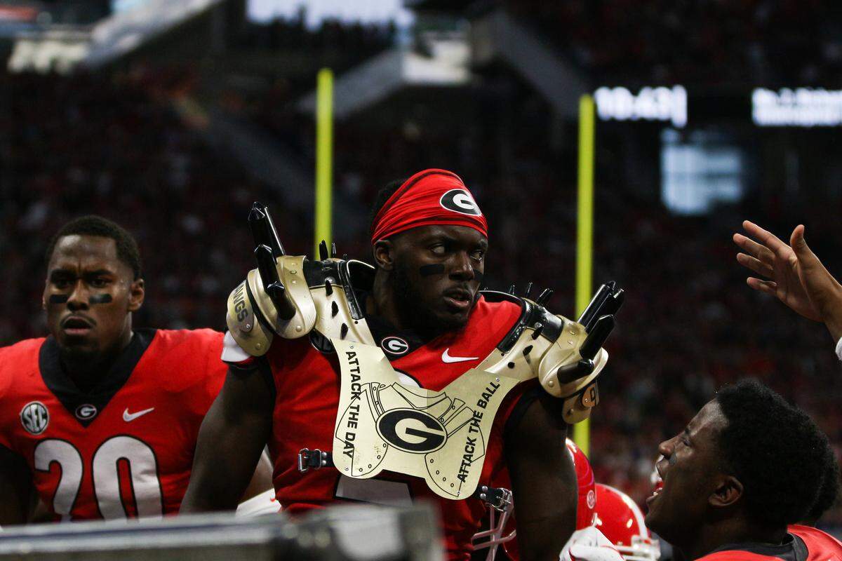 Players celebrate with the savage pads during the SEC Championship game between the University of Georgia and the University of Alabama in the Mercedes-Benz Stadium in Atlanta, Ga., on Dec. 1, 2018.