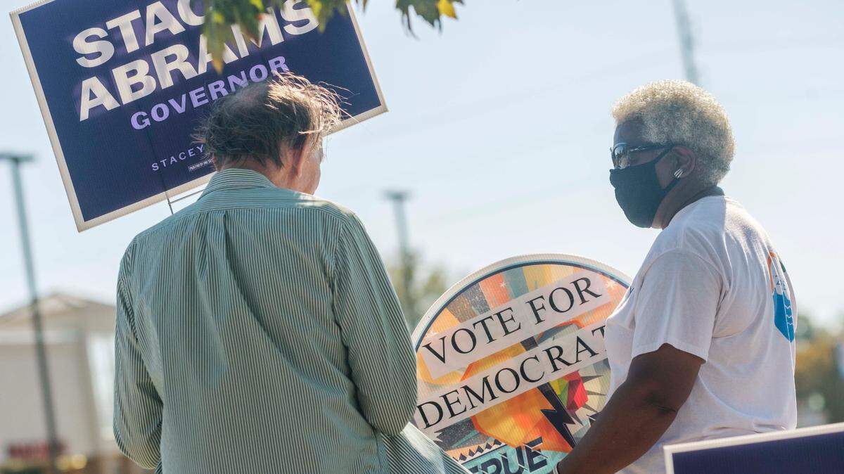 Houston County Democrat Evelyn Tharpe, right, says she knocked on 3,000 doors over four weeks heading into Election Day. “I’m voting for positive changes for the people,” she said. She hopes to see more affordable housing and a brand new slate of elected officials.