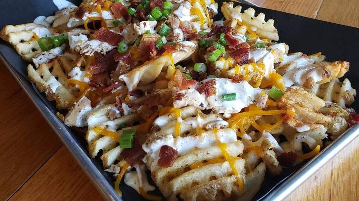 Here’s the entry from Piedmont Brewing & Kitchen for the Downtown Macon French Fry Fight on Wednesday: Chicken bacon ranch fries, waffle fries topped with shredded cheddar, smoked chicken, bacon, ranch dressing and garnished with green onions.