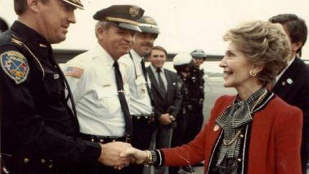 SPECIAL TO THE TELEGRAPH 
 Charlie Bishop, a former deputy Macon police chief, greets former first lady Nancy Reagan at Middle Georgia Regional Airport in 1984.