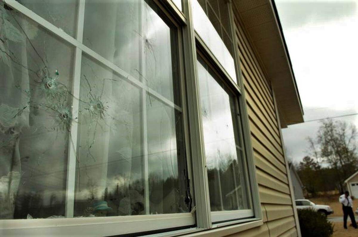 A bullet-riddled window at Gwendolyn Cole’s east Macon home in February 2008.