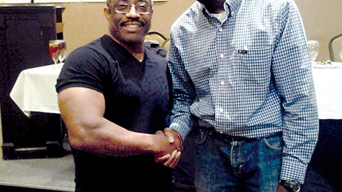 SPECIAL TO THE TELEGRAPHShawn McClendon stands with former Mr. Universe Yohnnie Shambourger at the Middle Georgia Wellness and Fitness Festival.
