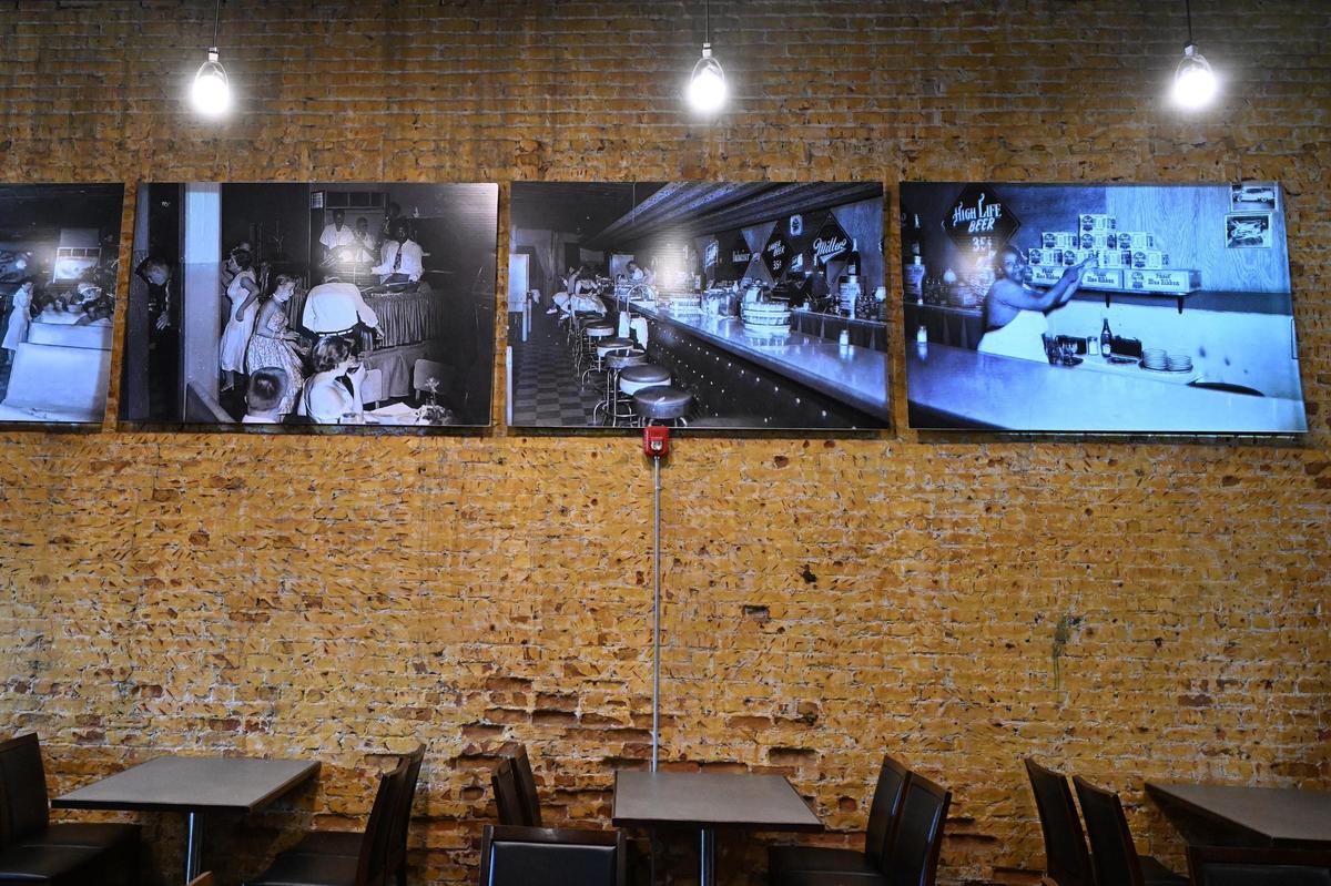 Archival pictures from the original Ann’s Tic Toc Room hang inside of the new Tic Toc on Tuesday, June 10, 2025, in Macon, Georgia. The pictures, all taken in the 1950s, pay homage to the history of the space, whose famous performers included Macon music legends such as Little Richard.