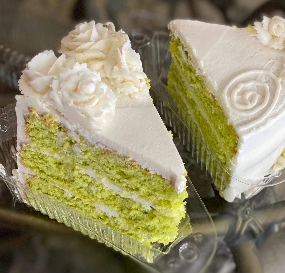 Slice of Mega Key Lime Cake from Sweet Rain Vegan Bakeshop. “Our tangy yet sweet let like cake layers iced in our amazing vanilla cream icing. These whopper slices are with us at most farmers markets and pop-up shops.”