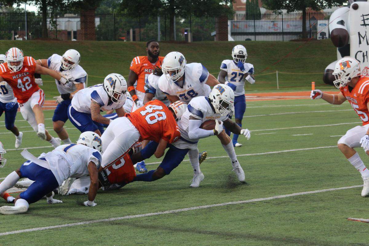 Mic Wasson (#48) tackles a Morehead State running back during the Bears 63-13 victory Saturday at Five Star Stadium.