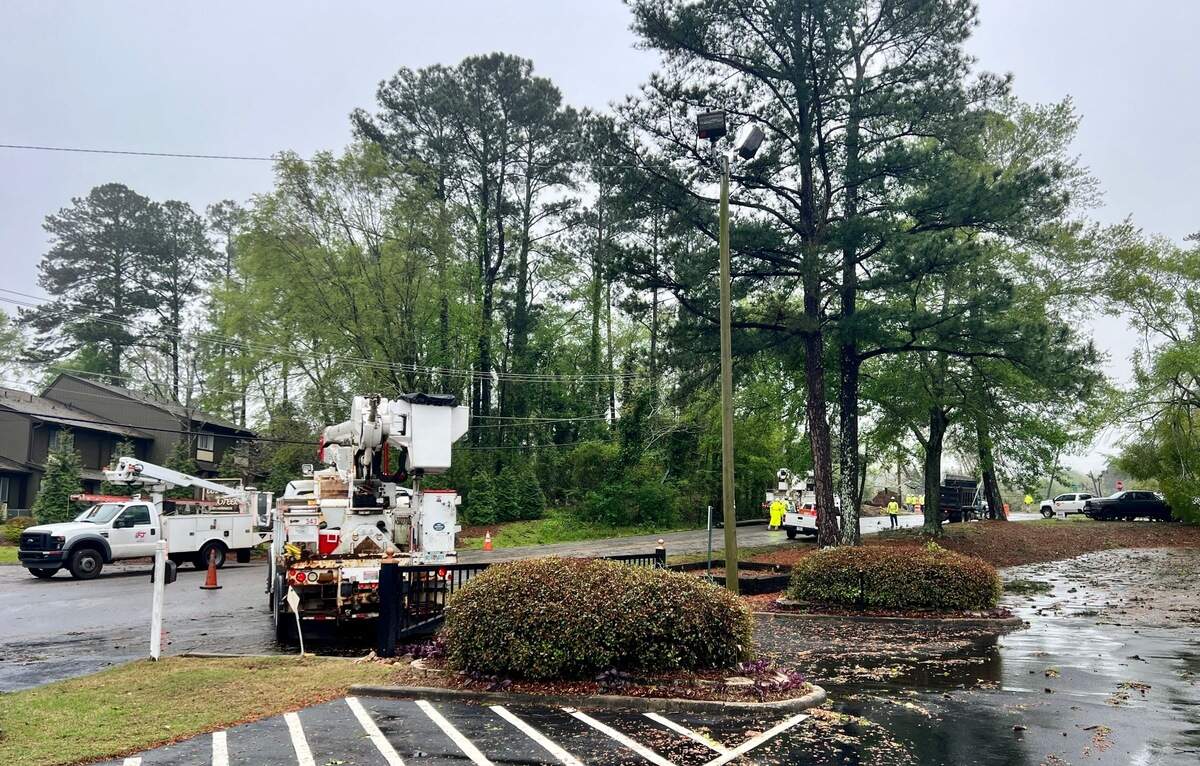 Utility crews survey storm damage along Wimbish Road in Macon. More than 1,700 Bibb County residents remain without powre, and more severe weather is on the way.