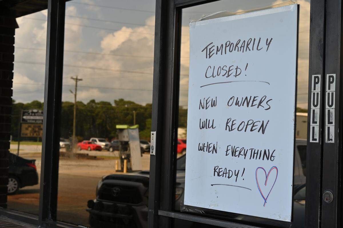 A sign on the front glass door of My Father’s Place off Moody Road in Warner Robins on July 23, 2025.