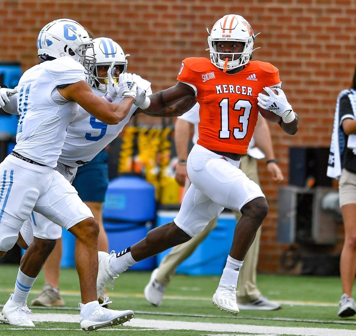 DONN RODENROTH,Macon, Georgia, 02/27/2021: Mercer wide receiver Ty James shrugs off a couple Citadel defenders on his way to a first down Saturday in Macon. Mercer beat The Citadel 42-28.