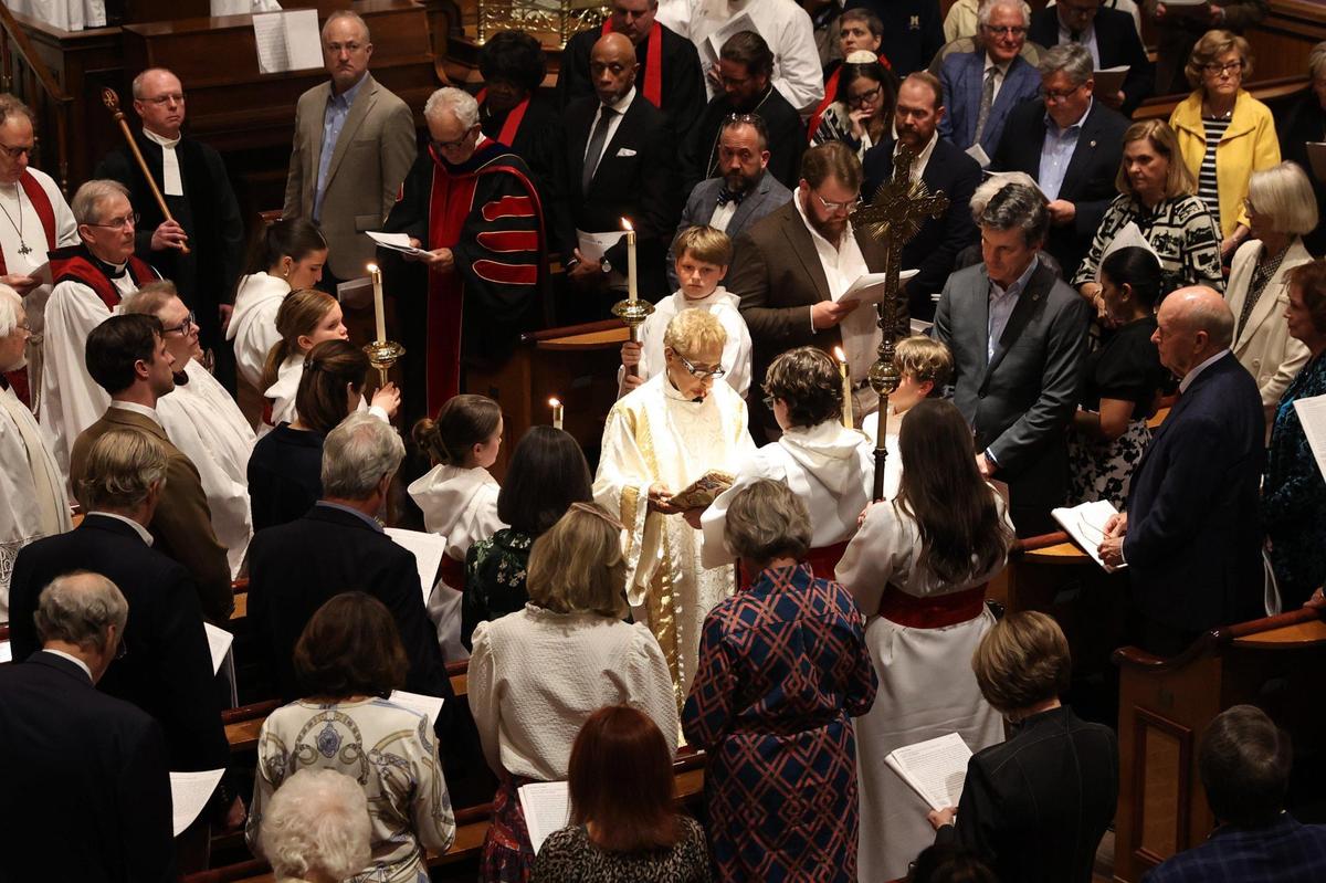 Archdeacon of the Episcopal Diocese of Atlanta Janet Tidwell reads the gospel from the middle of the sanctuary during the bicentennial service at Christ Church Episcopal on Thursday, Feb. 27, 2025, in Macon, Georgia. Christ Church marked the 200th anniversary of its founding with a celebratory service that included top church leadership from the Episcopal Archdiocese of Atlanta, church members as well as faith and local leaders from Macon.