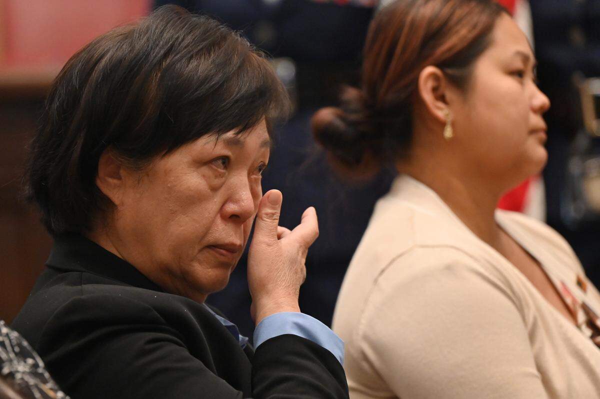 Hye Guilham, from Athens, Georgia, wipes her tears as Judge Tilman E. Self, III addresses the petitioners during a naturalization ceremony on Wednesday, April 8, 2026, at the Bootle Federal Courthouse in Macon, Georgia. Guilham came to the United States from South Korea.