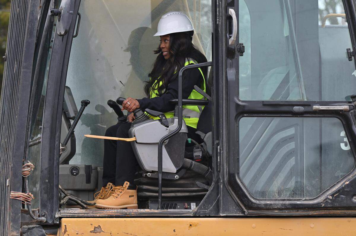 Warner Robins Mayor LaRhonda Patrick reacts as she moves an excavator to destroy 401 N. Commercial Circle as a part of the city’s “Operation Reawaken” initiative on Wednesday, Feb. 19, 2025, in Warner Robins, Georgia. The demolition is the fourth in series of Warner Robins demolitions as a part of the city’s “Operation Reawaken” initiative to destroy blight and rebuild.