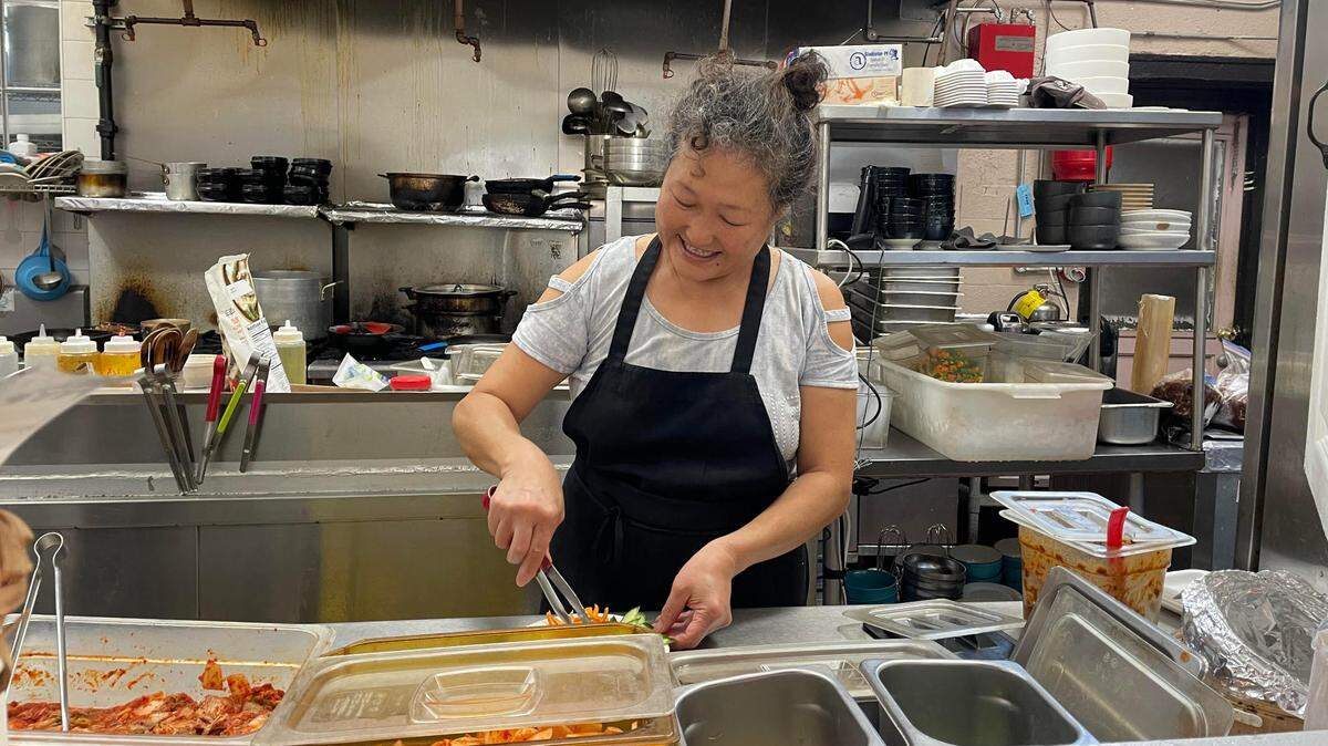 Kimchi Factory owner Miyang Rutherford prepares food at the Korean restaurant in downtown Macon. The restaurant is closing.
