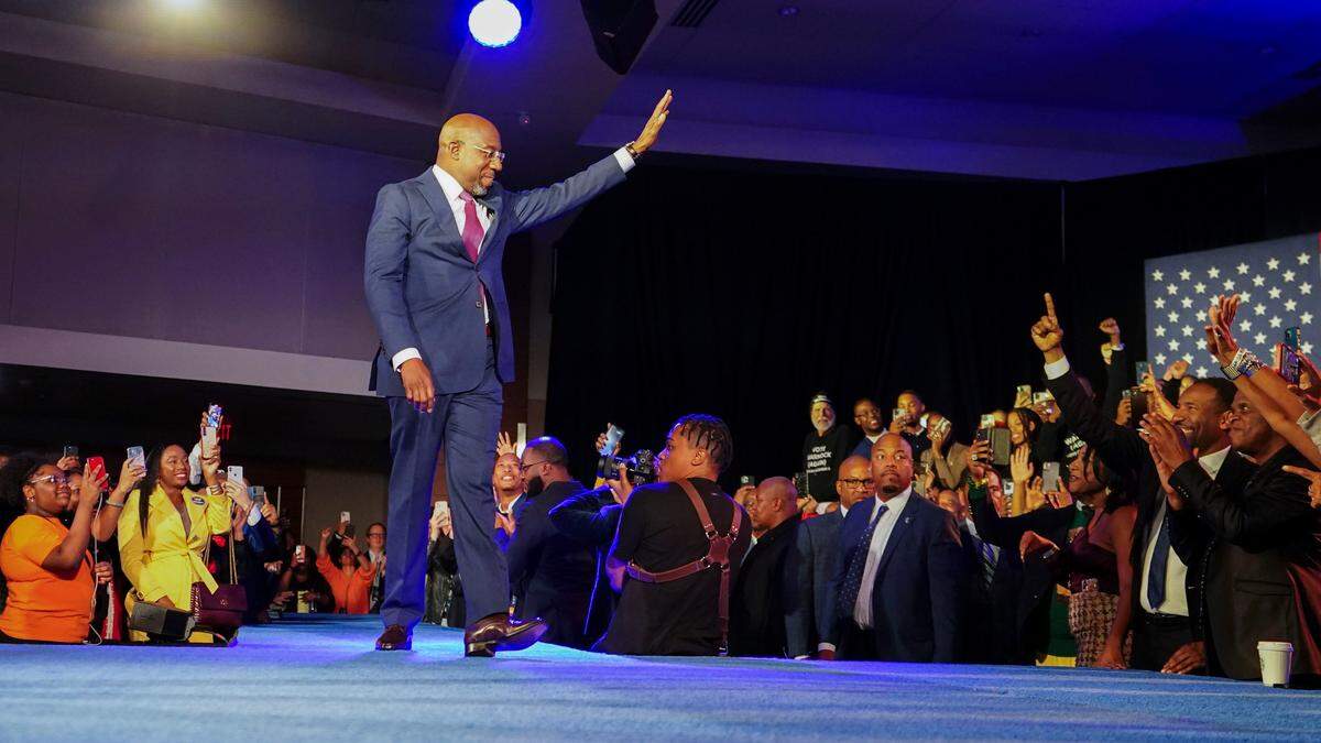 Democratic Sen. Raphael Warnock speaks during an election night watch party, Tuesday, Dec. 6, 2022, in Atlanta. Sen. Warnock has defeated Republican challenger Herschel Walker in a runoff election in Georgia. (AP Photo/John Bazemore)