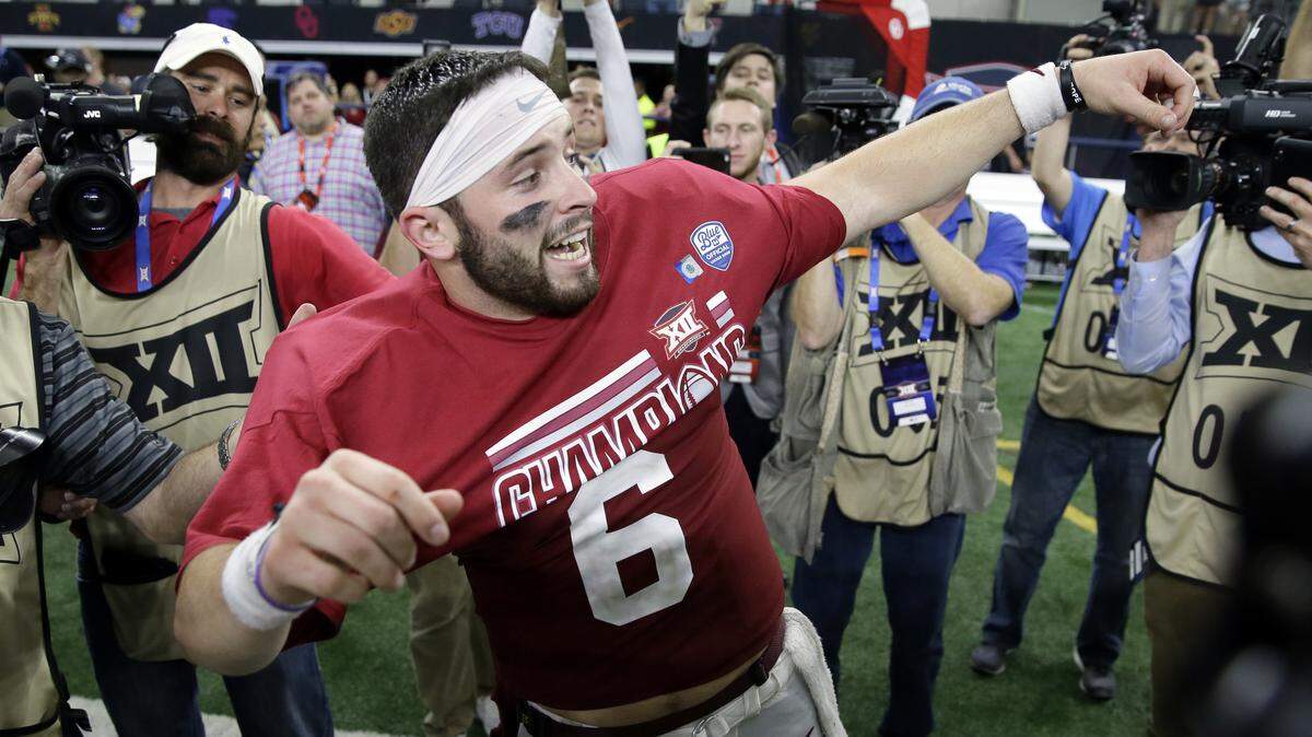 Baker Mayfield celebrates after Oklahoma won the Big 12 Championship.