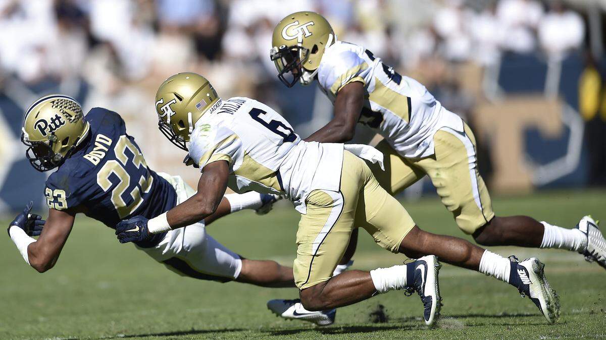 Pittsburgh wide receiver Tyler Boyd (23) makes the catch against Georgia Tech defensive back Chris Milton (6) during the second half of Saturday's game in Atlanta.