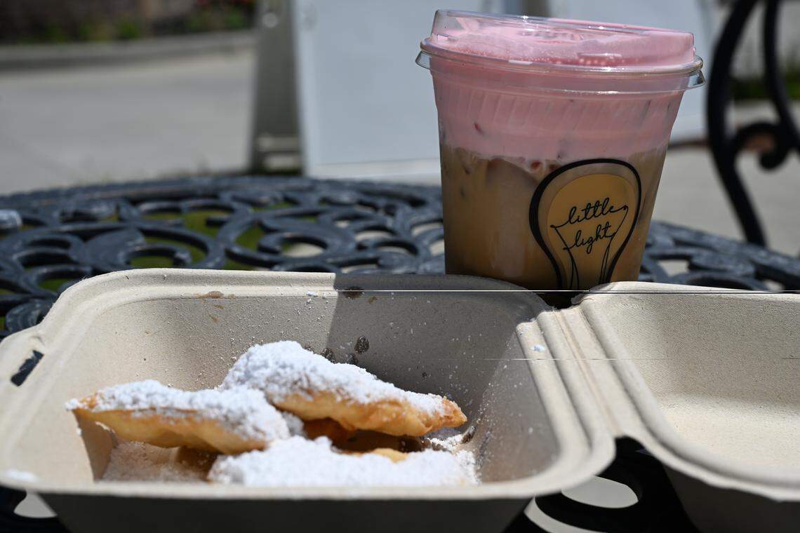 April monthly menu item cherry blossom latte with  beignets from the new Little Light Coffee Co. location off Ga. 247.