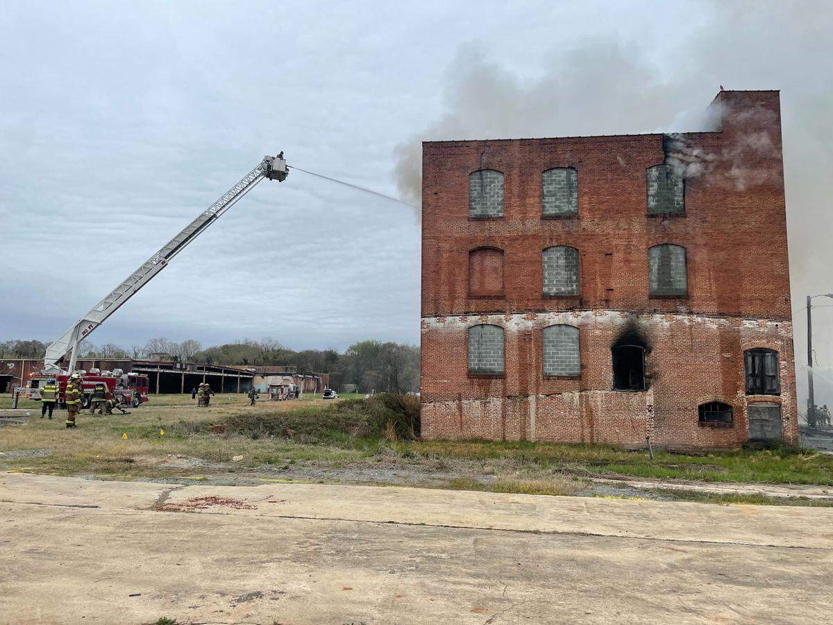 Bibb County fire crews battle a multi-story fire in downtown Macon Tuesday morning.