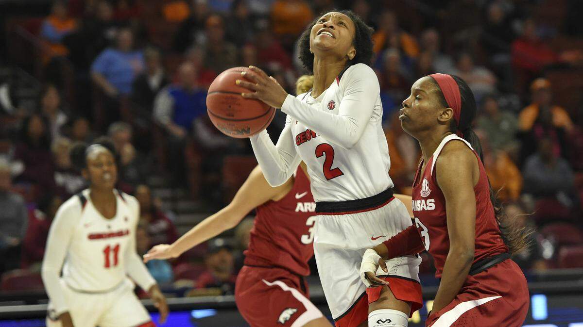Georgia’s Gabby Connally (2) drives against Arkansas’s Mailca Monk during the first half of a women’s Southeastern Conference NCAA college basketball tournament game Thursday, March 7, 2019, in Greenville, S.C.