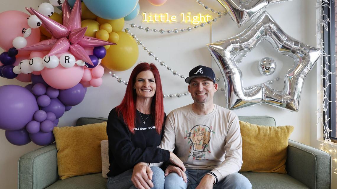 New Little Light Coffee Co. owners Jaimi (left) and Kevin Norrell pose on the couch inside the popular coffee shop in Warner Robins.